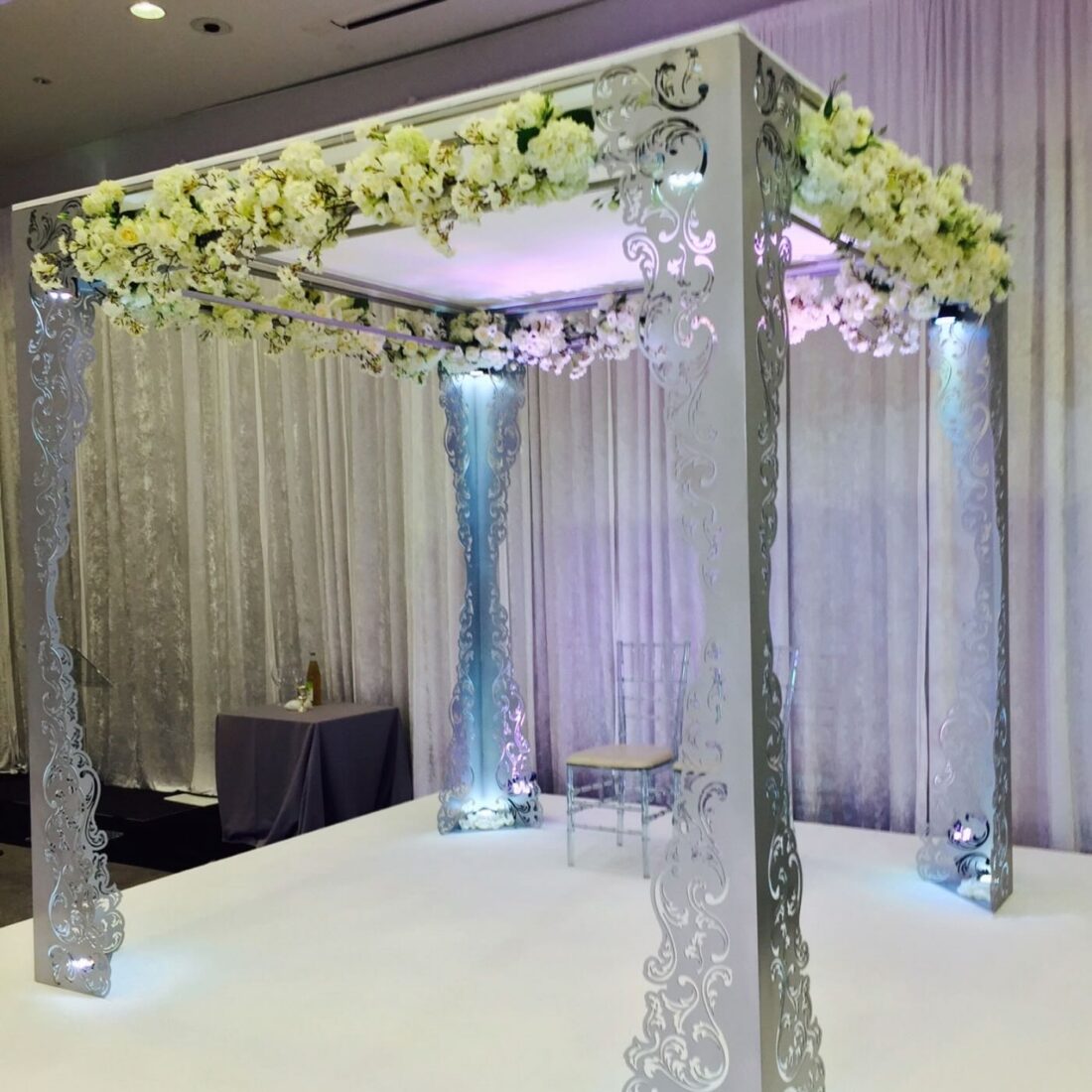 Metal Lace Chuppah - Laser-cut panels that throw lace shadows across the floor, the walls and the couple.
