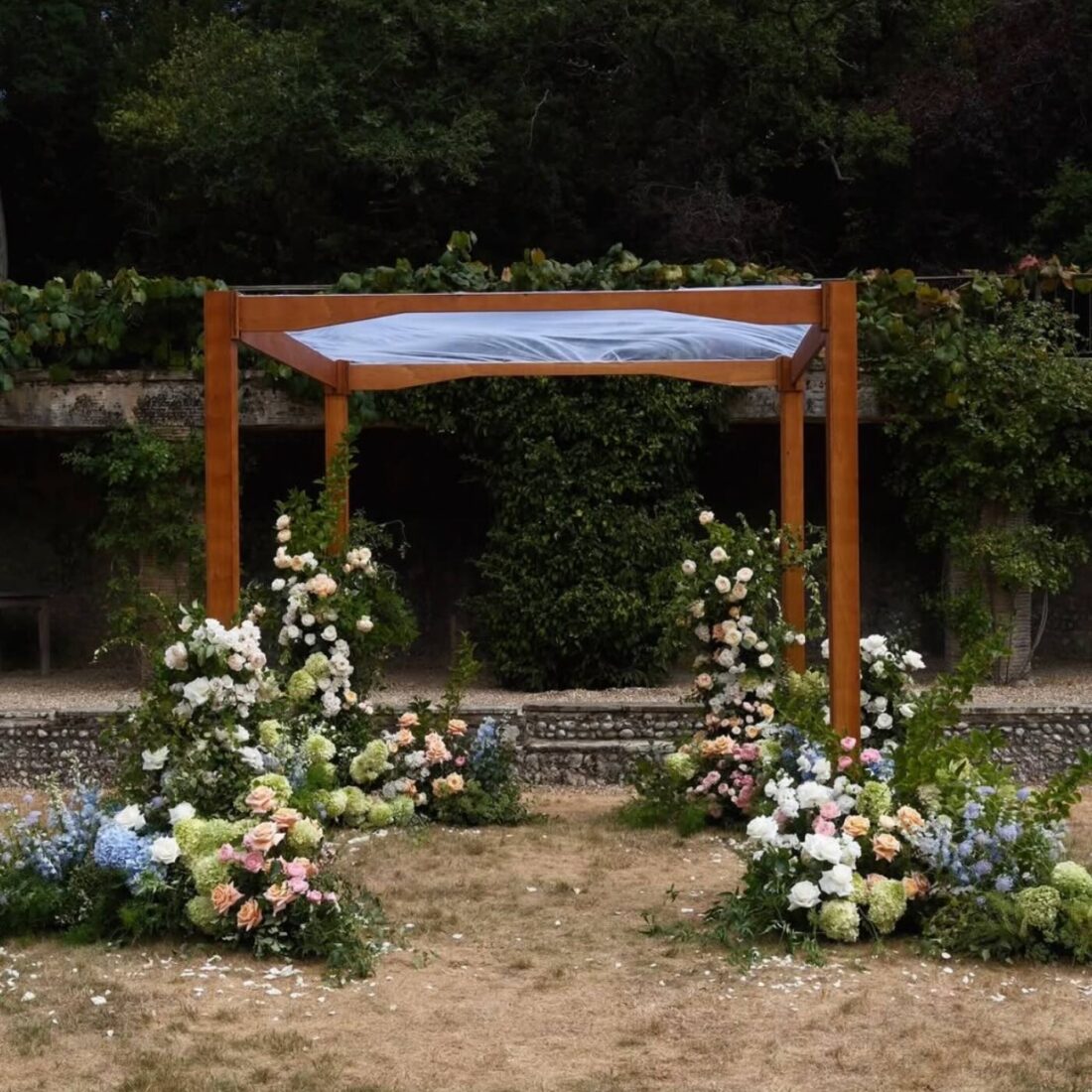 Natural Wood Chuppah - Stained and finished oak with sweeping shaped beams. The only frame in the collection where the timber itself is the finish.