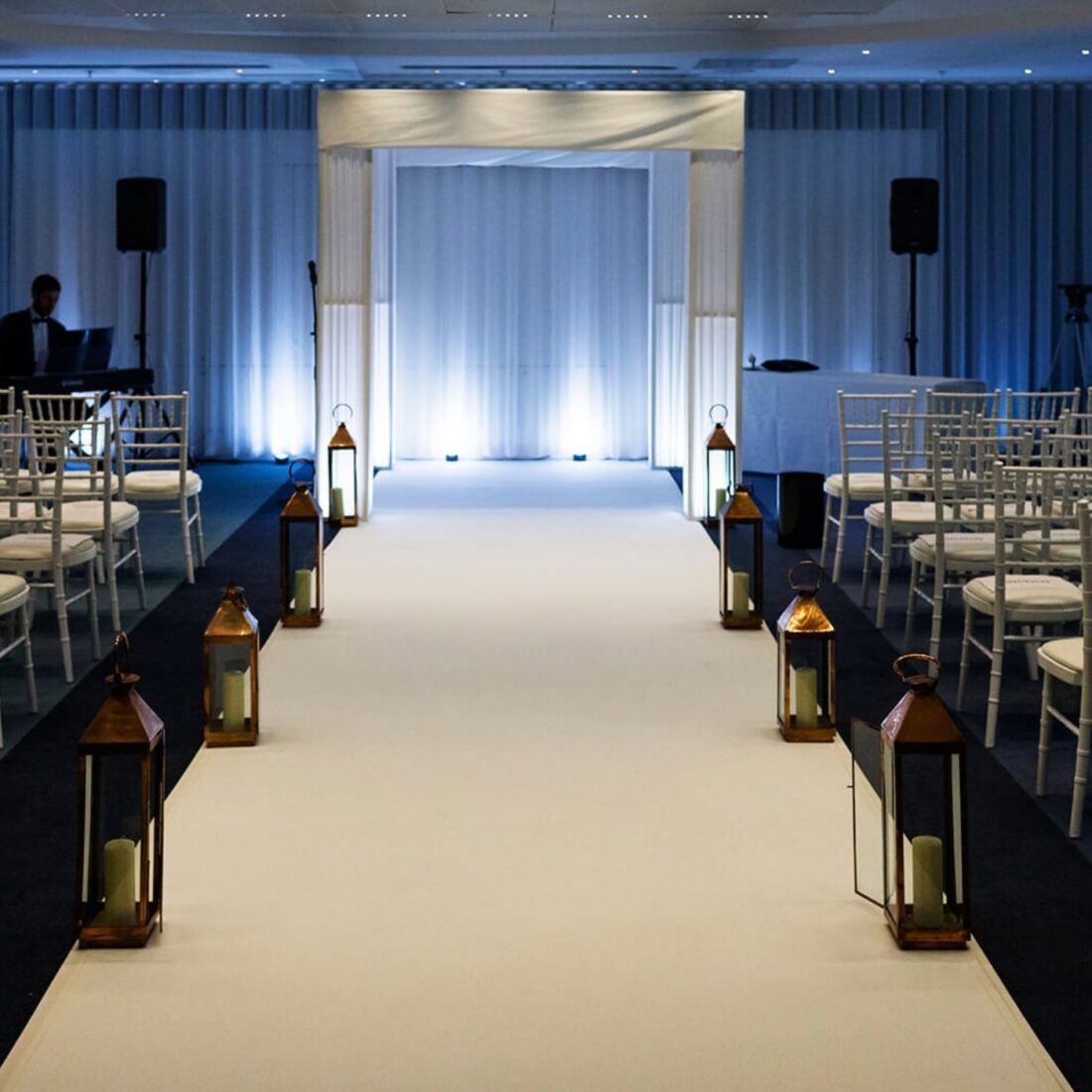 Pleated Column Chuppah - Sculptural pleated columns lit from within - a warmer, softer glow than clear acrylic.